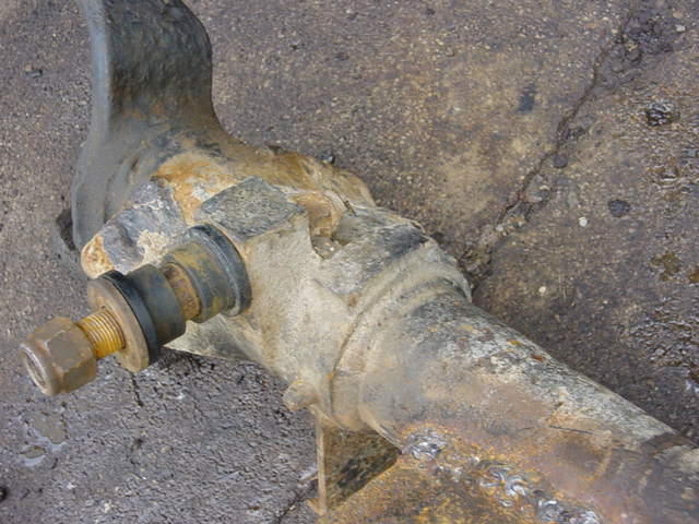 Rusted suspension part with a nut and bolt