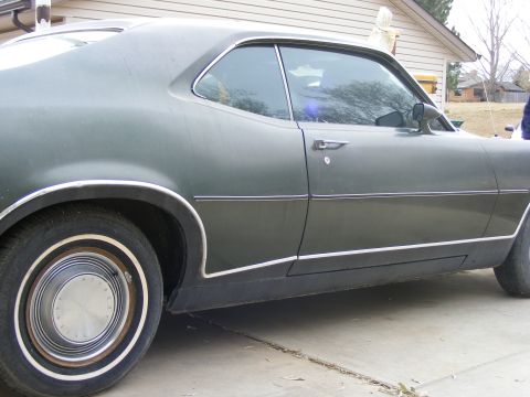 1971 Mercury Cyclone - Side view of a 1971 Mercury Cyclone showing its body lines and trim.