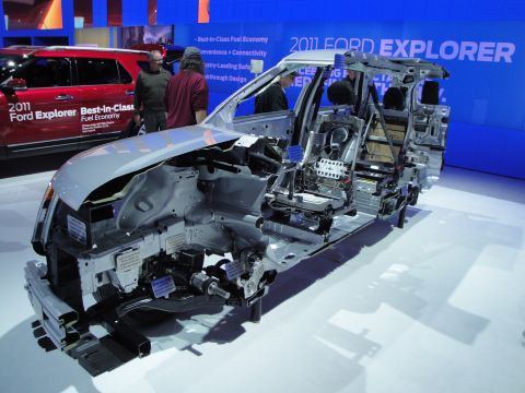 1993 Ford Taurus - Cutaway chassis of a 2011 Ford Explorer at an auto show display.