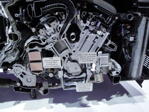 1993 Ford Taurus - A detailed cutaway of a V6 engine highlights its internal components and performance specifications.