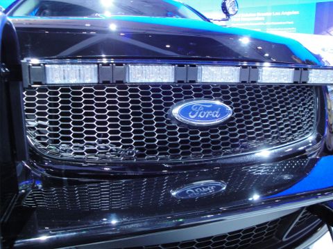 1993 Ford Taurus - Close-up of a Ford police vehicle's front grille, equipped with a light bar.