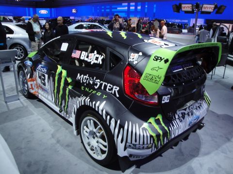 1993 Ford Taurus - This Ford Fiesta rally car features extensive Monster Energy branding and a large rear spoiler.
