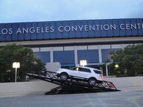 1993 Ford Taurus - A white SUV is positioned on a ramp outside the Los Angeles Convention Center.