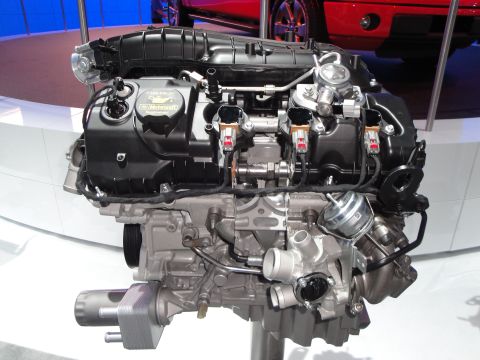 1993 Ford Taurus - Close-up of a Ford engine, likely on display at an auto show.