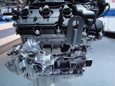 1993 Ford Taurus - Close-up view of a modern engine assembly, likely on display at an auto show.