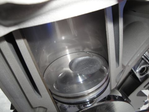 1993 Ford Taurus - Close-up of an engine piston within its cylinder, showing internal engine components.