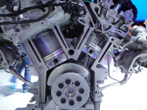 1993 Ford Taurus - A detailed view of a V6 engine's internal workings, including pistons and crankshaft.