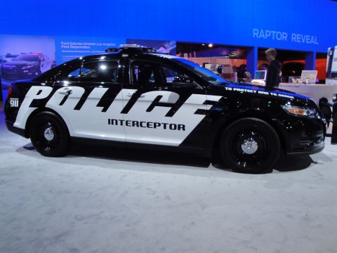 1993 Ford Taurus - A police interceptor vehicle is displayed at an auto show.