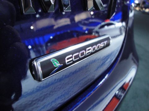 1993 Ford Taurus - The ECOBOOST emblem is visible on the rear of a dark blue vehicle.