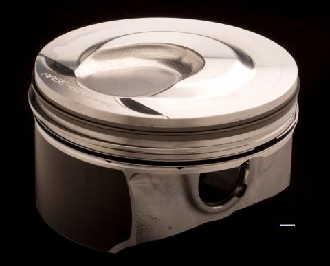 1993 Ford Taurus - Close-up of a polished piston, showing engraved text 'PASE-616-419' on its crown.