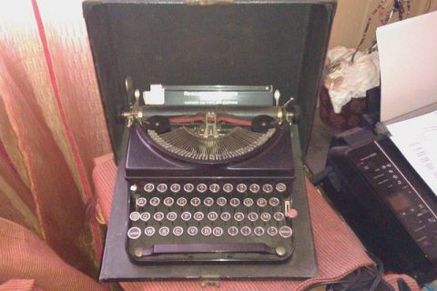 1991 Ford LTD Crown Victoria - A vintage typewriter is shown inside its open carrying case.