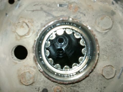 1998 Ford Crown Victoria - Close-up view of the interior of an axle housing, showing splines and grease.