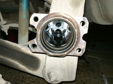 1998 Ford Crown Victoria - Close-up view of the inside of a rear axle differential housing, showing internal gears.