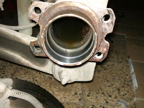 1998 Ford Crown Victoria - Differential axle housing showing internal bearing race, likely needing replacement.