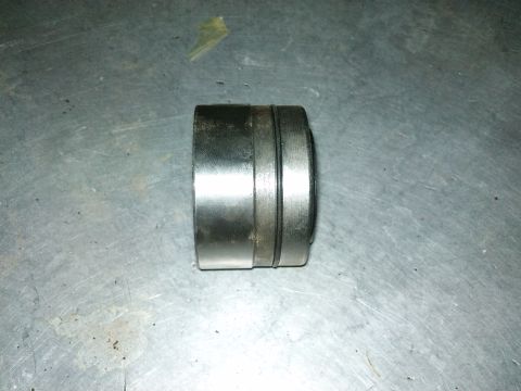 1998 Ford Crown Victoria - Close-up of a single wheel bearing, likely for a vehicle's axle.