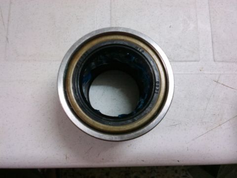 1998 Ford Crown Victoria - A close-up view of a wheel bearing, showing internal components and visible markings.