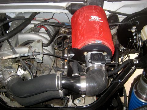 1996 Ford Bronco - Aftermarket K&N air filter and intake system installed in the engine bay.