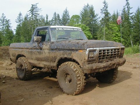 1978 Ford Bronco - Muddy 1978 Ford Bronco with '2 BIG BRONCOS 4X4 CLUB' sticker on windshield.