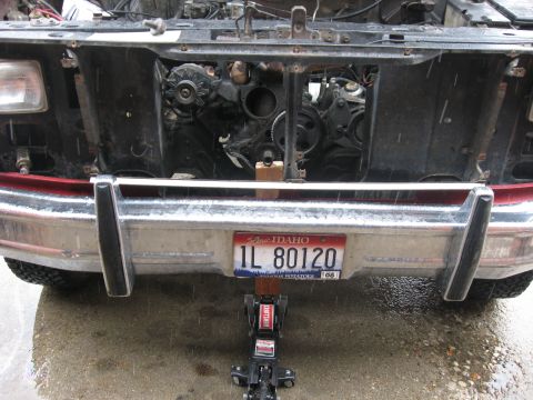1981 Ford Bronco - Didn't have a jack tall enough to reach the engine so I had to use a block of wood as an extension. The end of the crank worked well, altho…