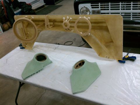 1975 Ford Bronco - Custom fiberglass speaker pods and dashboard panel are laid out on a table, with a vehicle grille visible in the background.