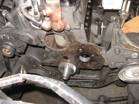 1981 Ford Bronco - Close-up of engine timing cover and gears, likely during a repair or rebuild.