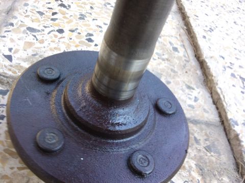 1998 Ford Crown Victoria - Close-up view of an axle shaft and hub assembly, likely for a vehicle's drivetrain.