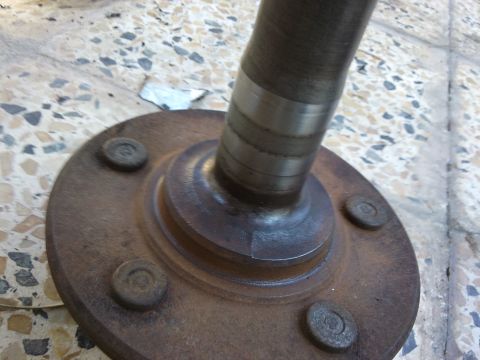 1998 Ford Crown Victoria - Axle shaft and hub assembly, likely from a Ford Crown Victoria, with visible rust and a Supermotors logo.