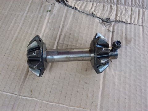 1998 Ford Crown Victoria - This photo shows differential pinion gears mounted on a shaft, with a bolt visible on the right side.