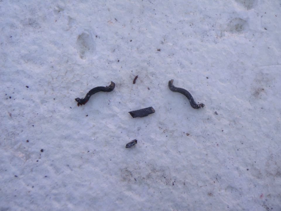 Broken metal pieces on snow