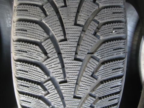 1993 Ford Probe - The image shows a detailed view of a tire's tread pattern, designed for traction.