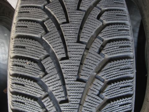 1993 Ford Probe - A detailed view of a tire's tread pattern, showing its aggressive design for traction.