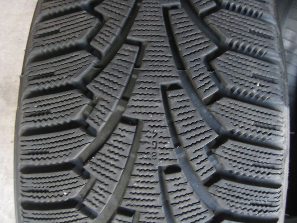 Close-up of tire tread with visible text '255/40R17'