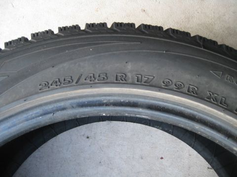 1993 Ford Probe - A close-up view of a tire, showing its size specifications and tread pattern.