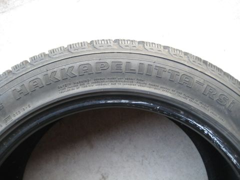 1993 Ford Probe - A close-up view of a tire shows brand and website information.