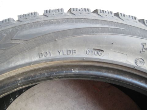 1993 Ford Probe - Close-up of a tire's sidewall showing the DOT code and manufacturing date of 0106.