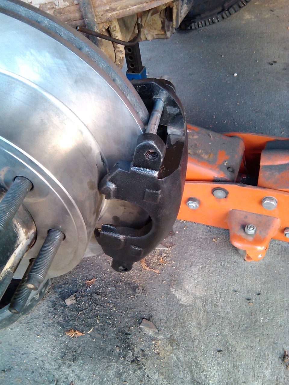 Close-up of a vehicle's front wheel, tire, and fender area