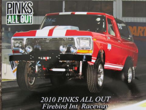 1979 Ford Bronco - This red Ford Bronco is ready for the track, with racing stripes and a modified front end.
