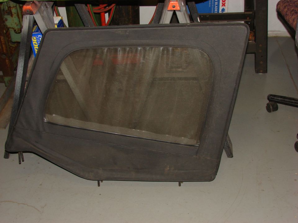 Black Jeep YJ soft top door with clear window
