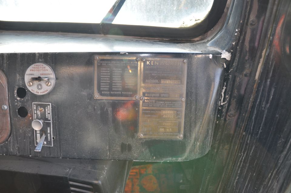 Vintage Kenworth cab dash with brass data plate, tractor protection valve and brake release