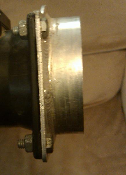 2000 Mercury Grand Marquis - Close-up of a metal pipe flange assembly, showing bolted connections and a gasket. The image includes a Supermotors.net watermark.