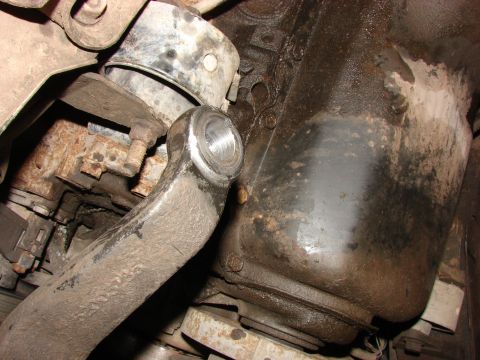 1993 Jeep Wrangler - Underside view of a vehicle's mechanical components, showing a suspension arm connected to the engine block.