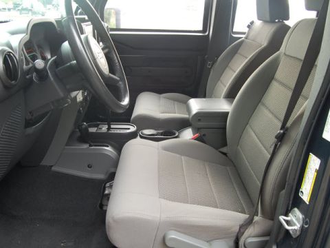 2005 Jeep Wrangler - Interior view of a 2005 Jeep Wrangler, highlighting the front seating area and controls.
