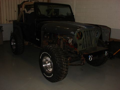 1993 Jeep Wrangler - This Jeep CJ-7 is undergoing some front-end work, with the grille and fenders removed.