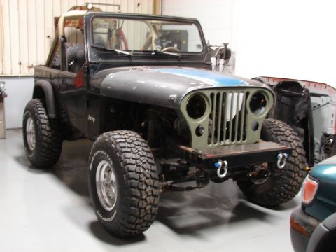 1993 Jeep Wrangler - This 1993 Jeep YJ features a custom front end with a modified grille and hood, its off-road capabilities.