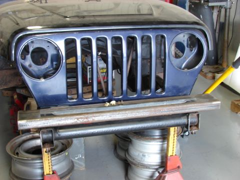 1993 Jeep Wrangler - Front end of a 1993 Jeep YJ, showing the iconic grille and hood.