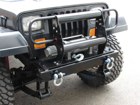 1993 Jeep Wrangler - This 1993 Jeep YJ features an aftermarket front bumper with a winch and tow hooks.
