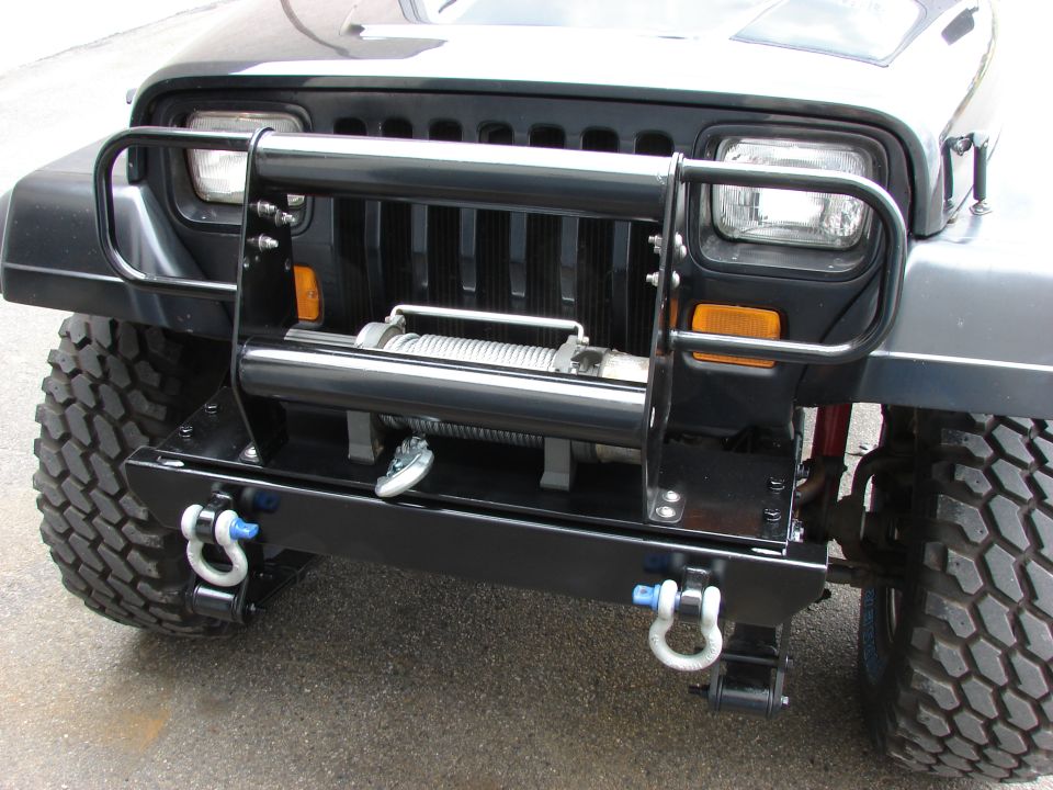 1993 Jeep YJ front with aftermarket bumper, winch, and tow hooks