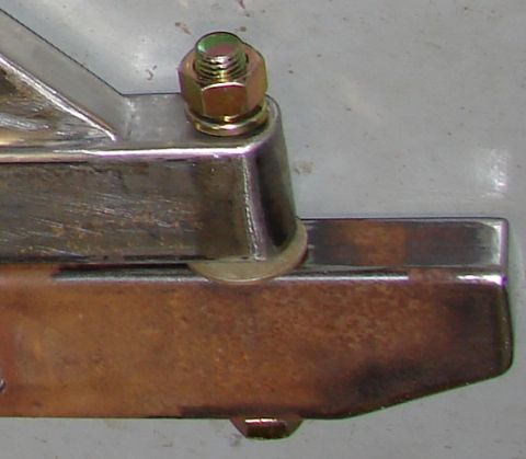 1993 Jeep Wrangler - A close-up view of a metal bracket assembly, a bolt and nut, with a Supermotors.net watermark visible.