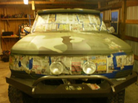 1995 Ford Bronco - This vehicle is being prepped for a new paint job in a garage setting.