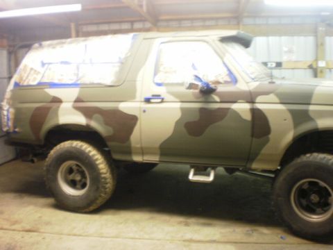 1995 Ford Bronco - This 1995 Ford Bronco is undergoing a camouflage paint job, with masking tape visible on the windows.